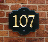 hand carved door number